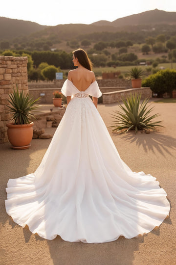 Robe de mariée longue corset en tulle ivoire à manches flottantes